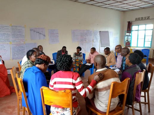 Participants in group discussion at HROC training, October 2024